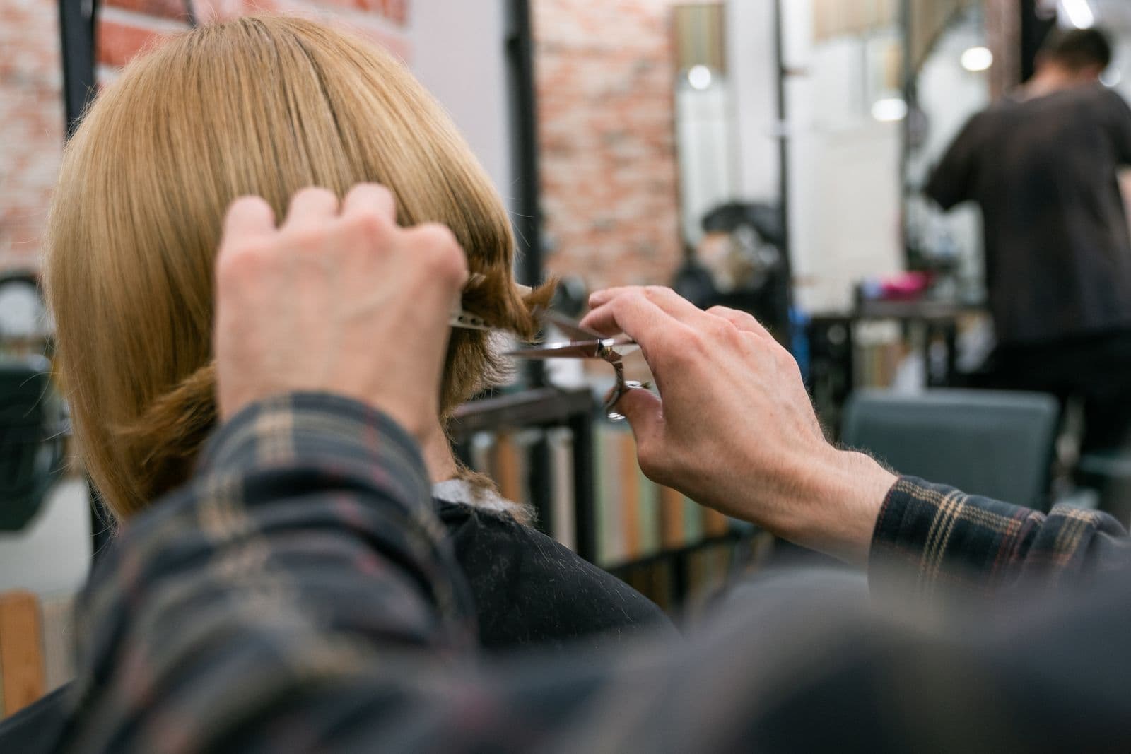 Woman showing off a fresh, polished haircut after a salon visit