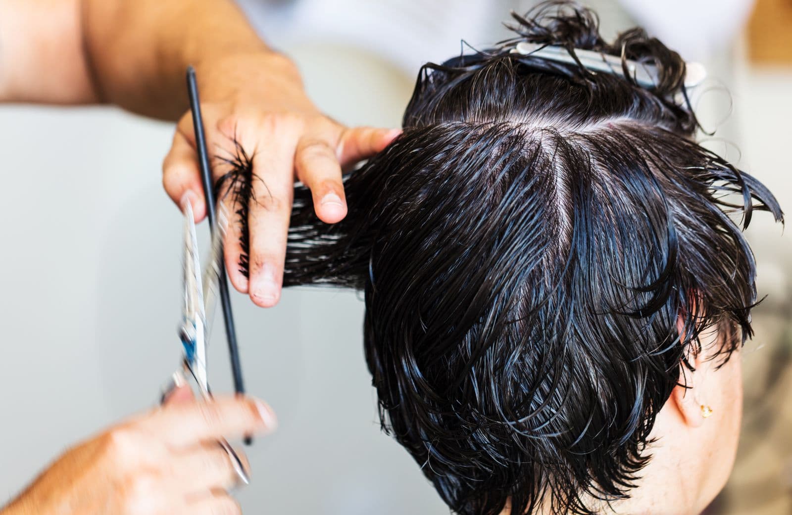 Happy client with a stylish new haircut and blow-dry at the salon