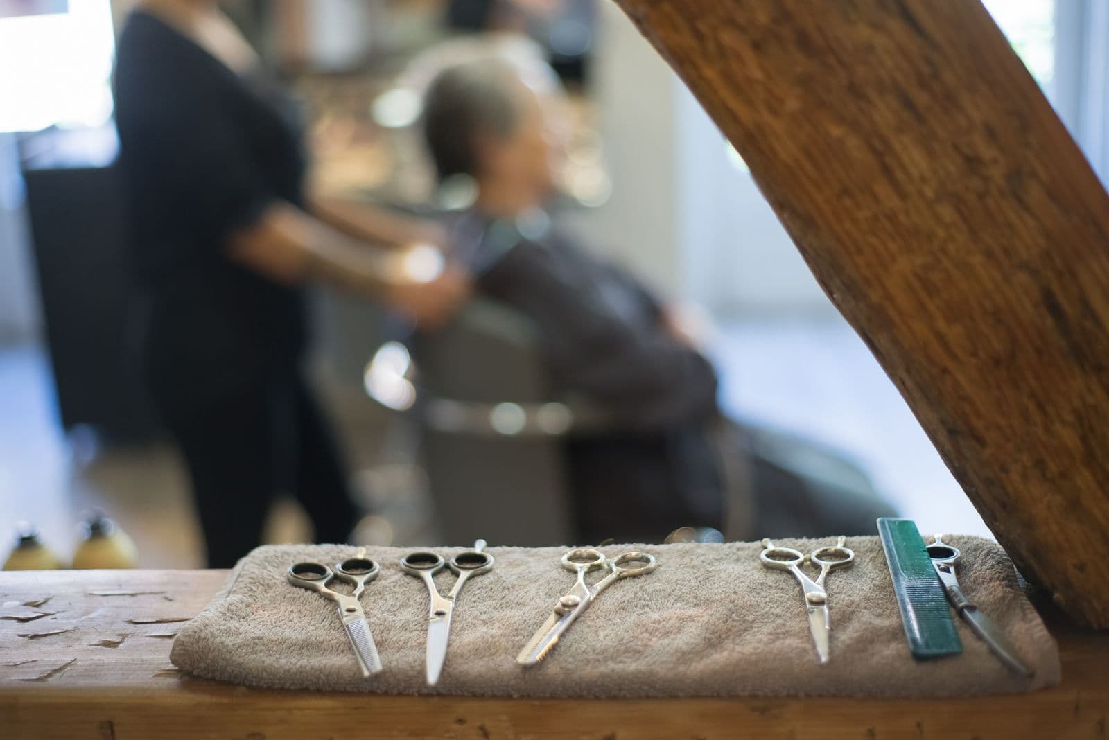 Close-up of salon styling chair and professional hairdressing equipment