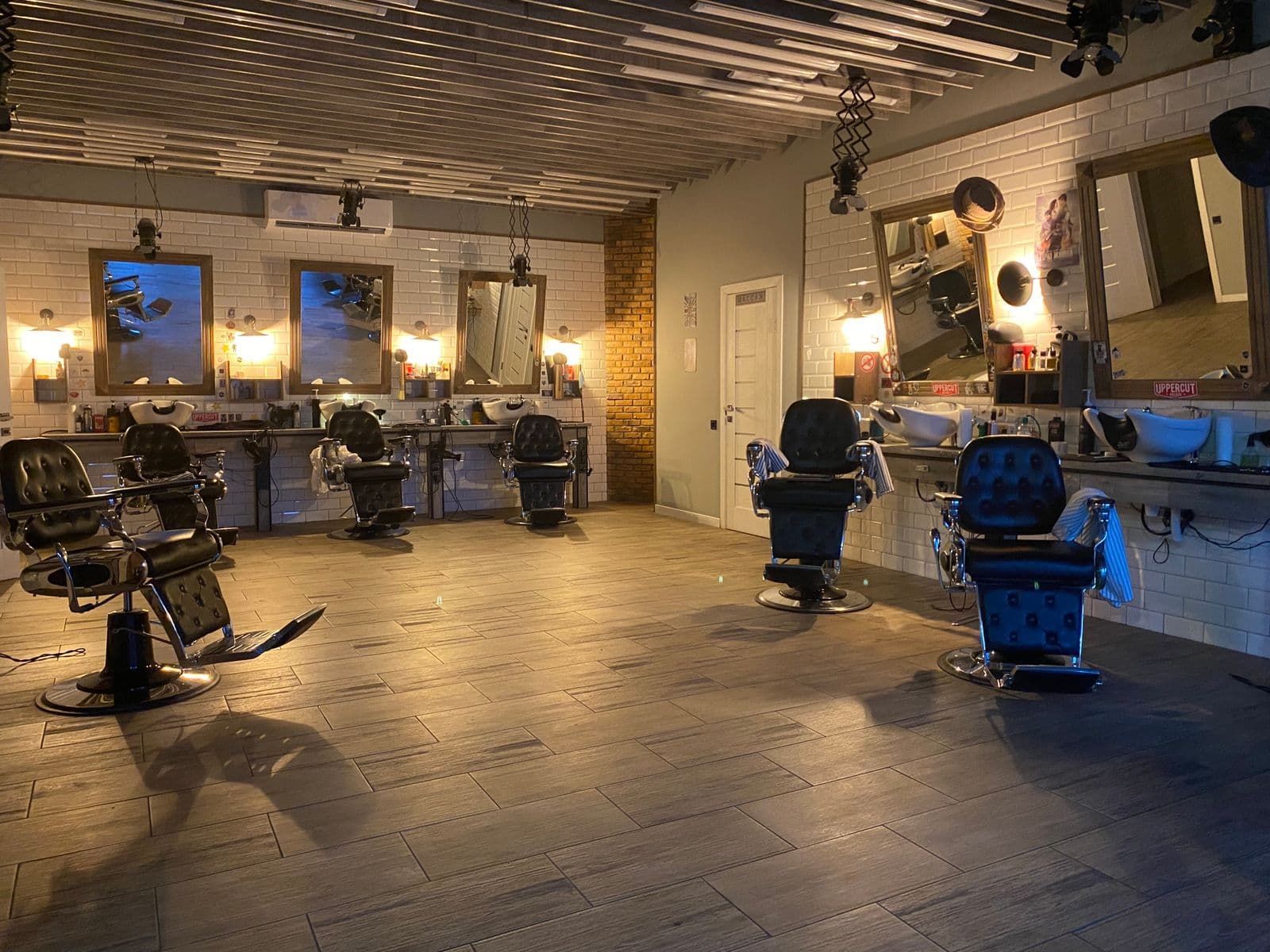 Salon styling station detail with chair, mirror and professional tools