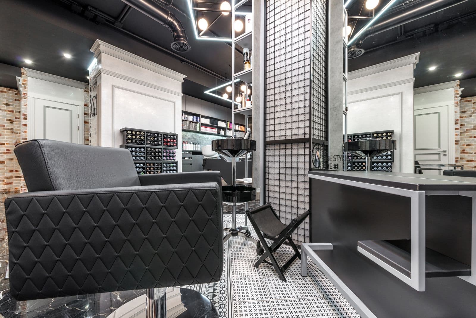 Bright, modern luxury hair salon interior with styling stations and large mirrors
